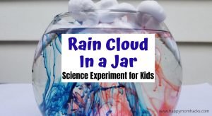 Cool Science Experiment for Kids at Home - Rain Cloud in a Jar. Teach kids about rain with shaving cream and food dye. The kids will be in awe of this super simple science experiment. #scienceathome #scienceexperiment #raincloudinajar #shavingcream