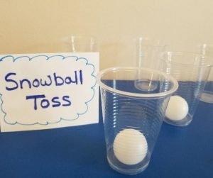 Snowball Toss is a fun Elementary Classroom Winter Party Games. Kids will love tossing these ping pong balls into the cup and seeing if they make it. A hilarious party game for kids.