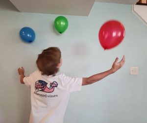 Keep it Up Bubble Challenge is a fun Minute to Win It game for teens. Kids try to keep 3 balloons up in the air for 1 minute without any touching the floor.